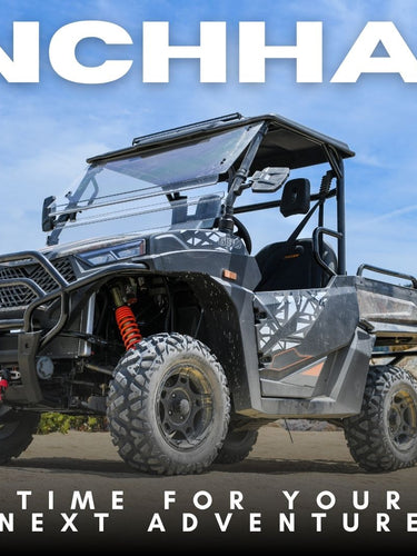 A Denago Powersports RanchHawk 650FI off-road utility vehicle parked outdoors on a dirt path with rocks and shrubs in the background. Large white text at the top reads 'RANCHHAWK' and smaller text at the bottom reads 'TIME FOR YOUR NEXT ADVENTURE'.